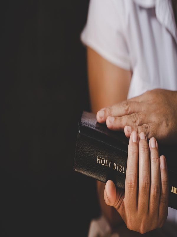 spirituality-religion-hands-folded-prayer-holy-bible-church-concept-faith